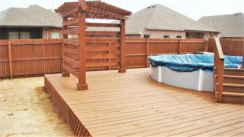 A deck in OKC stained with wood defender sable brown