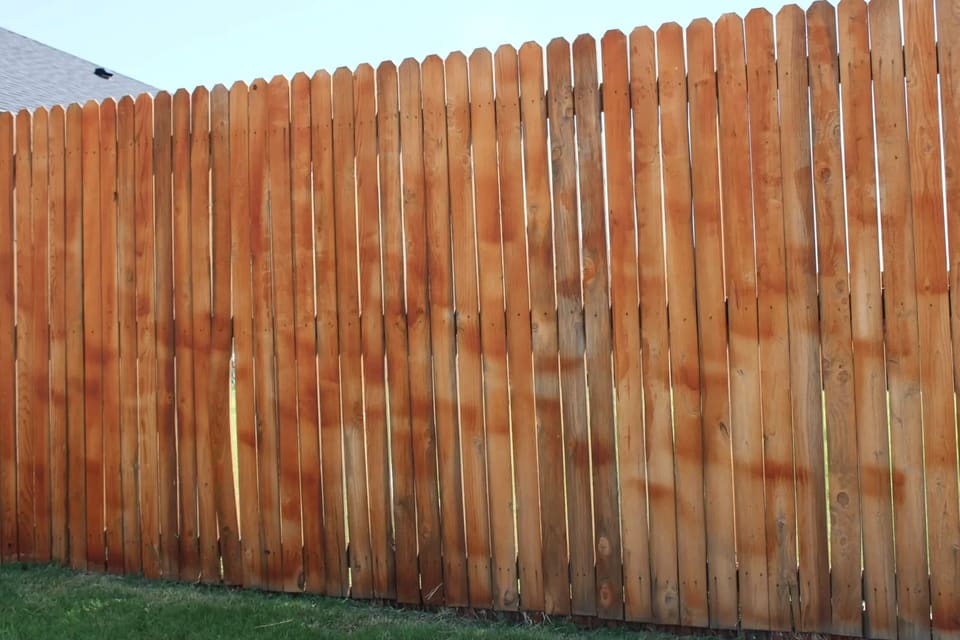 This fence was not stained by a pro and looks splotchy
