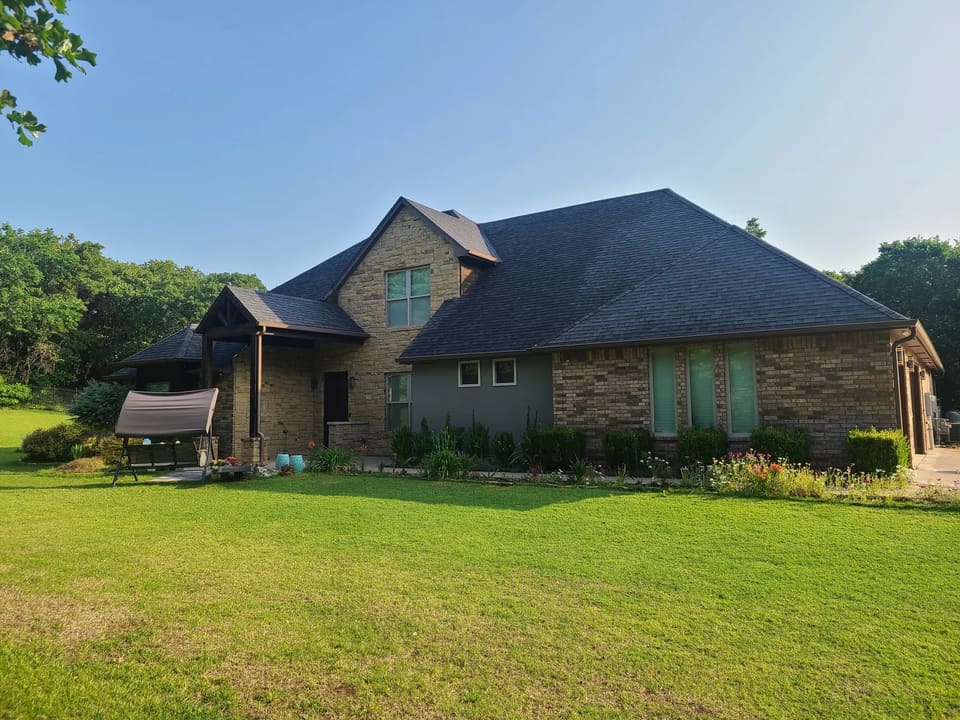 A home in Edmond OK with brick and stucco on the exterior