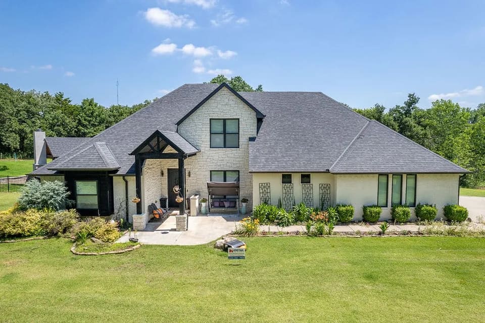 Freshly painted white brick and stone home exterior in the OKC metro