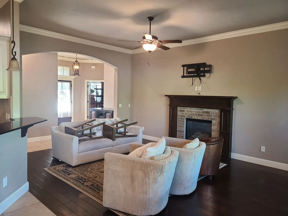 Living room with freshly painted walls and trim in an Edmond, OK home