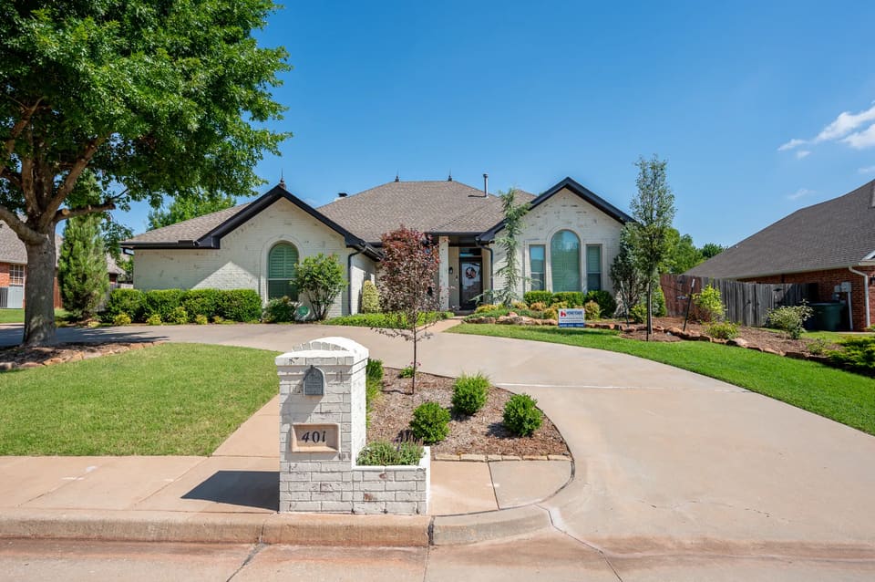 Painted white brick ranch home on Timberdale Drive in Edmond, OK