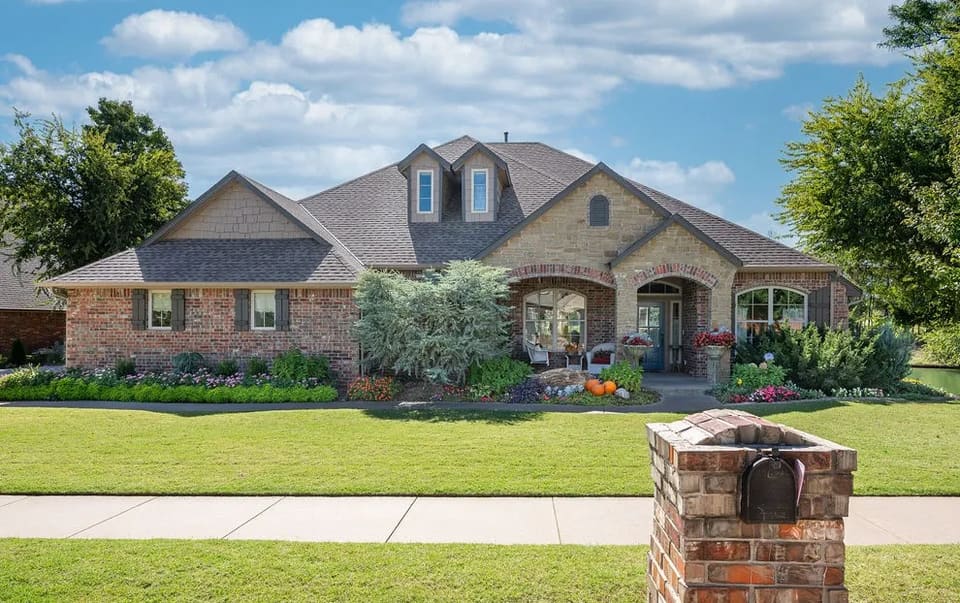 Exterior repaint of a brick and stone home on War Eagle Drive in Yukon, OK