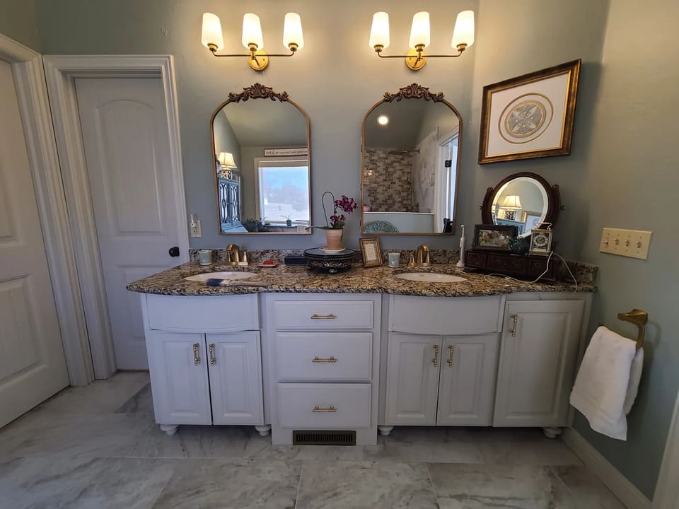 Double bathroom vanity painted white in a Yukon, OK home