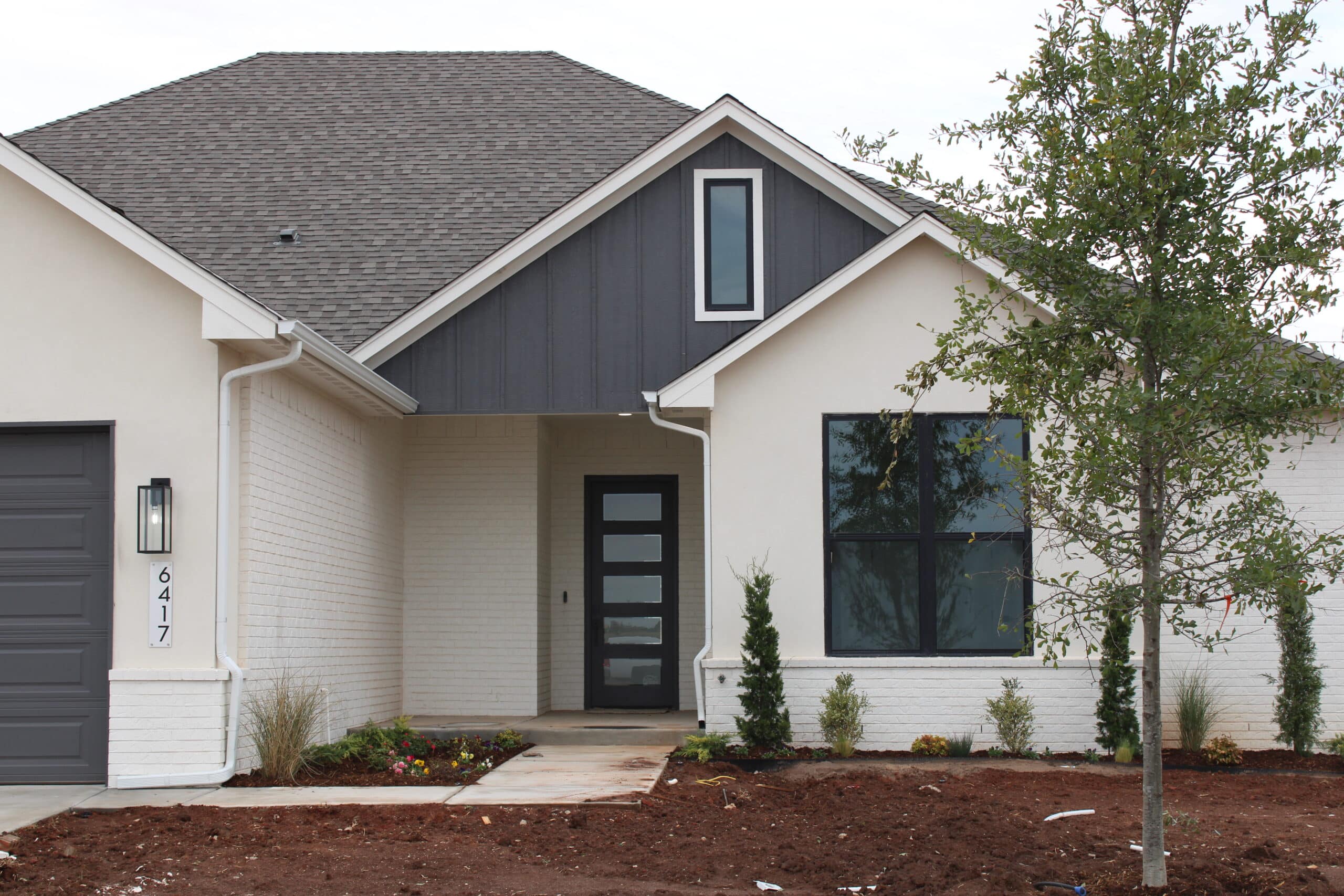 brick home in oklahoma city that has been painted white